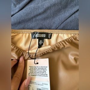 I am selling a tan leather skirt from Missguided